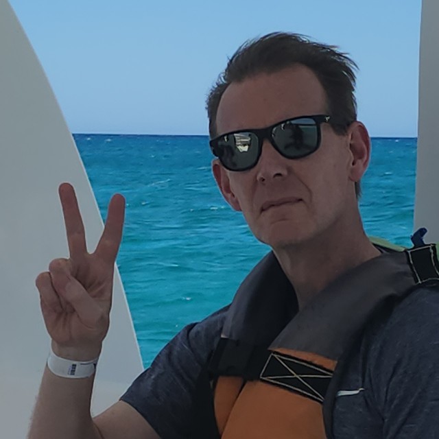 Dr. John Oliphant on a boat in the Dominican Republic